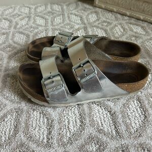Very well loved women’s Birkenstocks. Size 38.